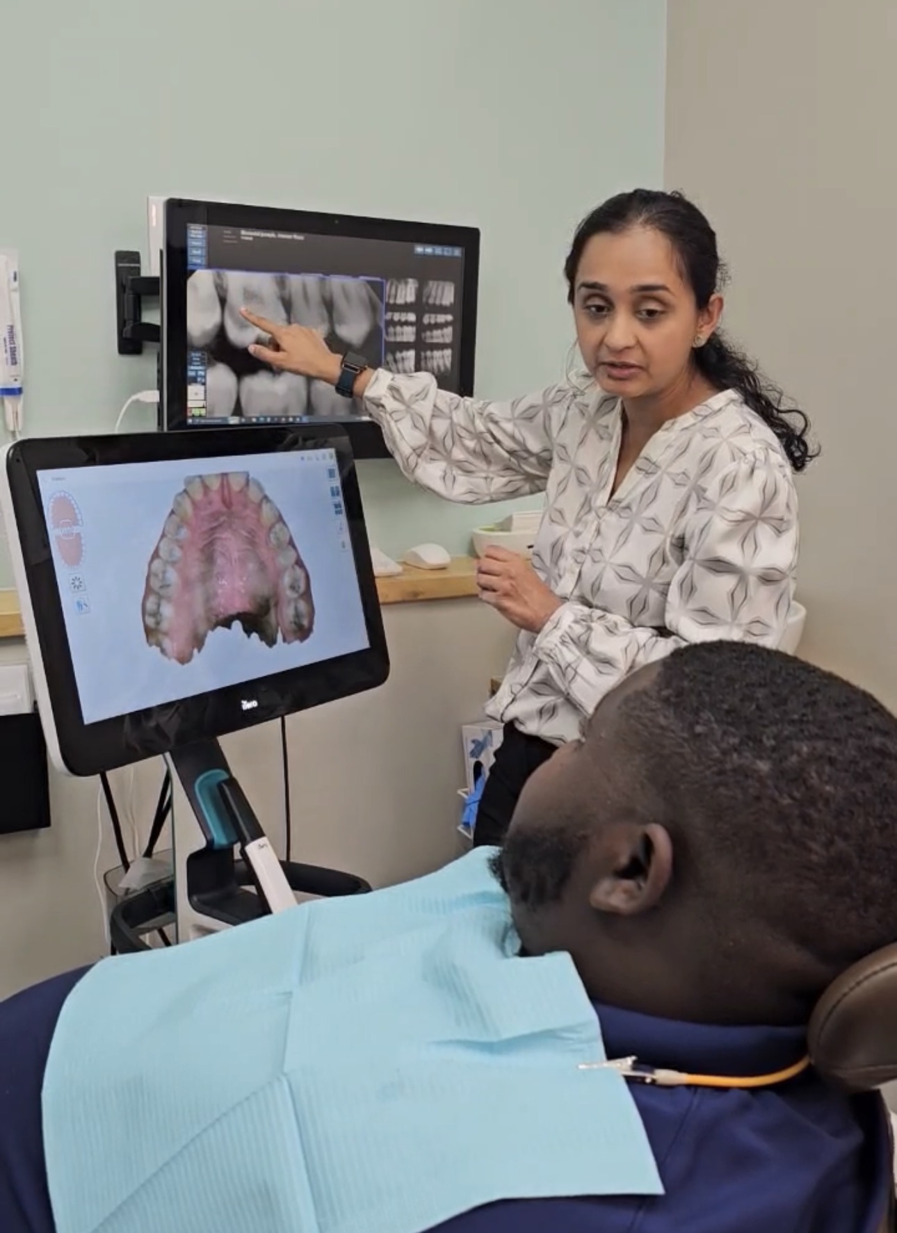 Dr. Boesch showing a patient their iTero scan results